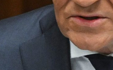 Poľský premiér Donald Tusk počas prejavu pred poslancami Sejmu 7. marca 2025 vo Varšave [PAP/Radek Pietruszka]